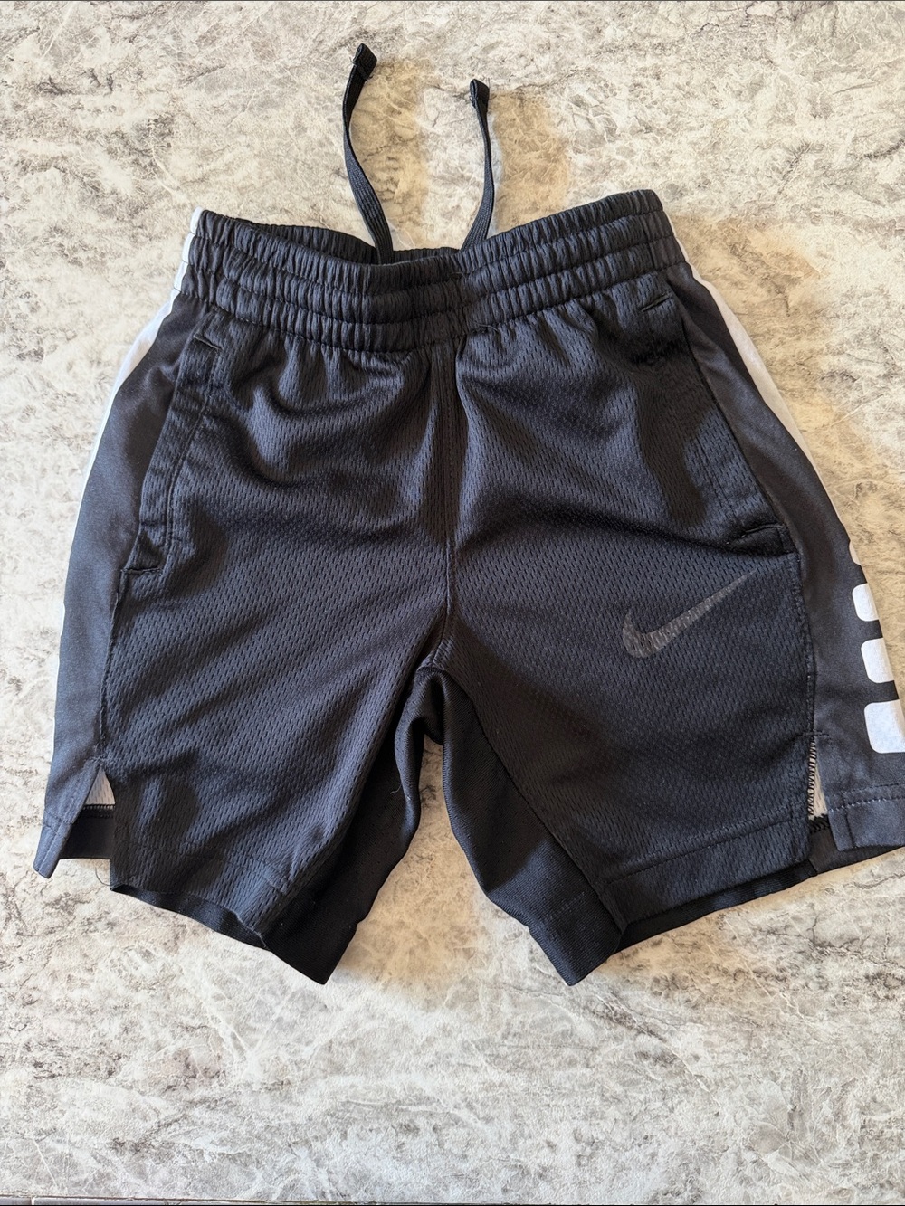 Nike Kids Black Athletic Shorts with White Side Accents
